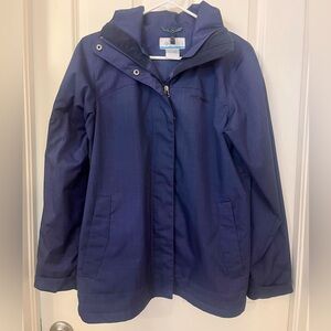 Navy blue small Columbia windbreaker without underlayer.